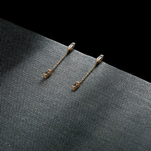 Gravity champagne baguette diamond chain earrings