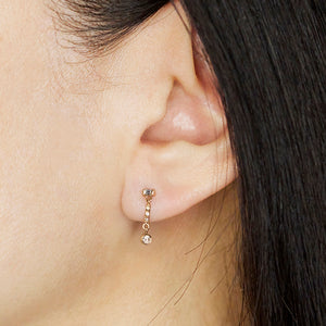 Gravity baguette and round diamond line earrings
