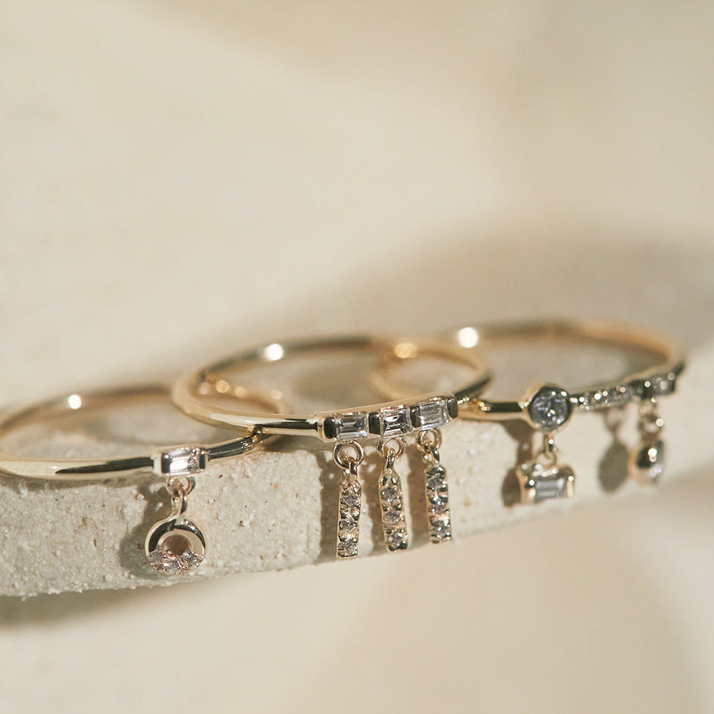 Gravity baguette diamond tassel ring
