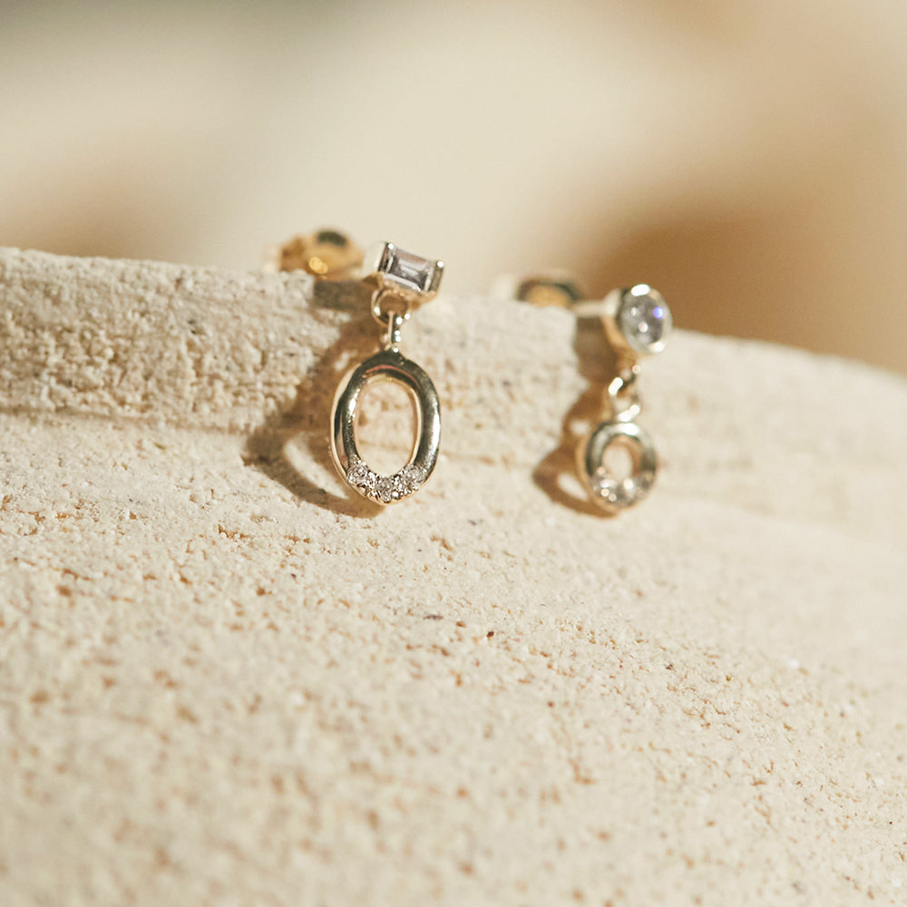 Gravity baguette diamond with oval hoop diamond earrings